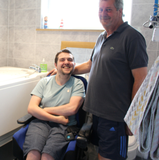 Tim Hayes and his Dad in their wheelchair accessible bathroom